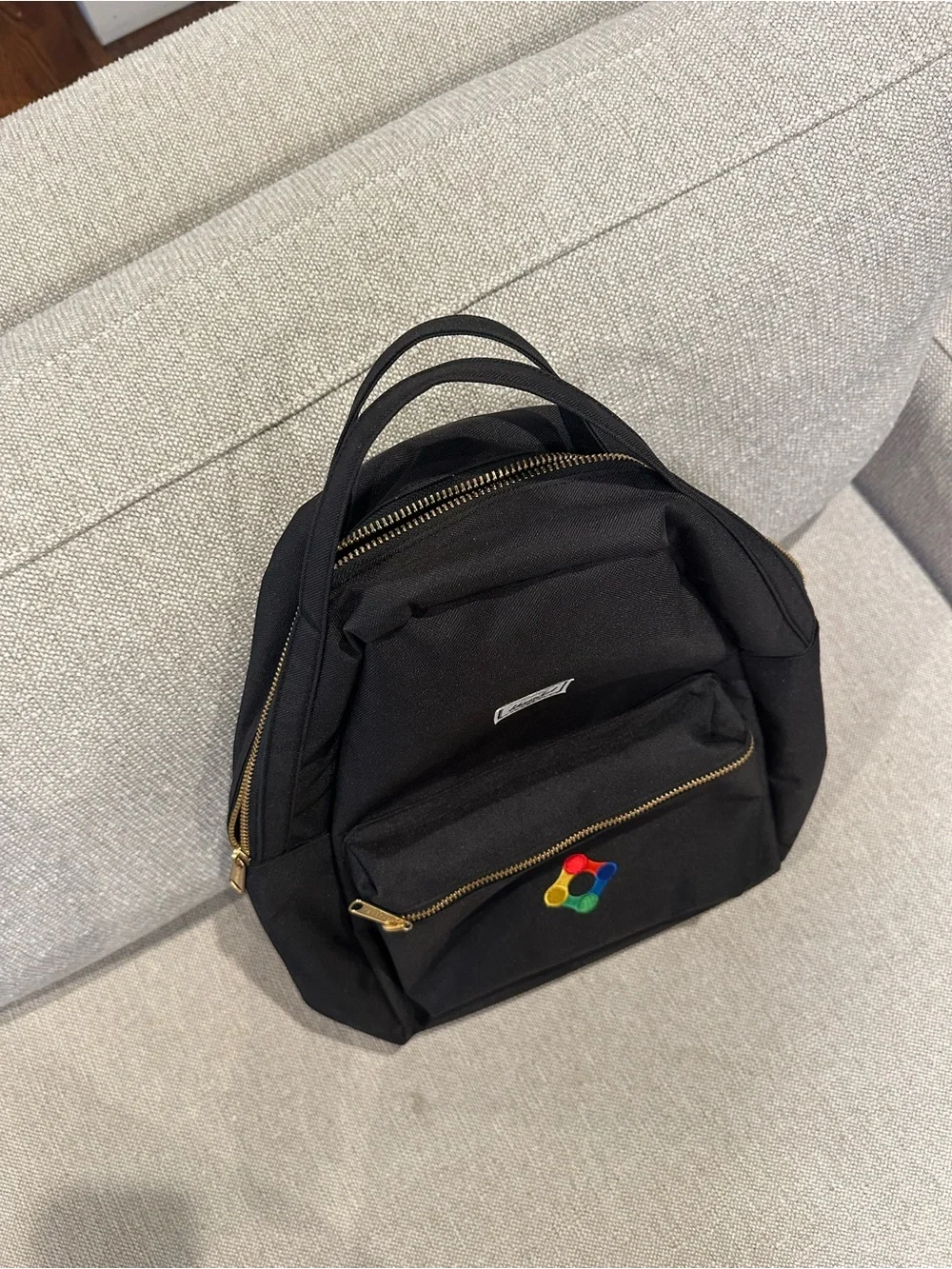 Black Herschel Backpack with Colorful Patch